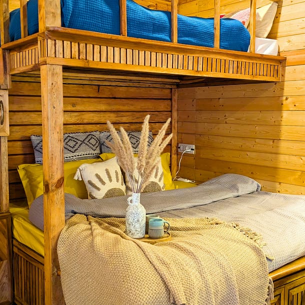 King size bed and single bunk bed on top